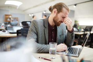 Migraines That Started After Something: Tracing the Trigger Back | Atlas Chiropractic 1 a man having a headache