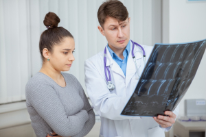 Your X-Rays Are Normal. Why Does Your Neck Still Hurt? | Atlas Chiropractic 5 people looking at an x-ray
