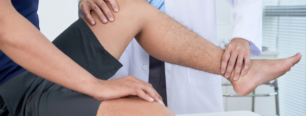 Doctor Checking Leg Of Patient original 536862